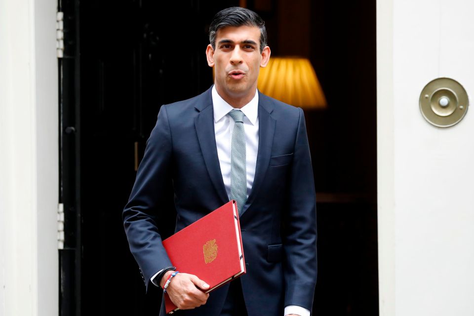 Rishi Sunak today - holding no red box but a red folder for his Budget