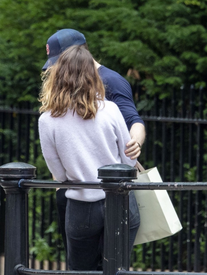 Hollywood star Chris touched Lily's arm as she leaned on a railing