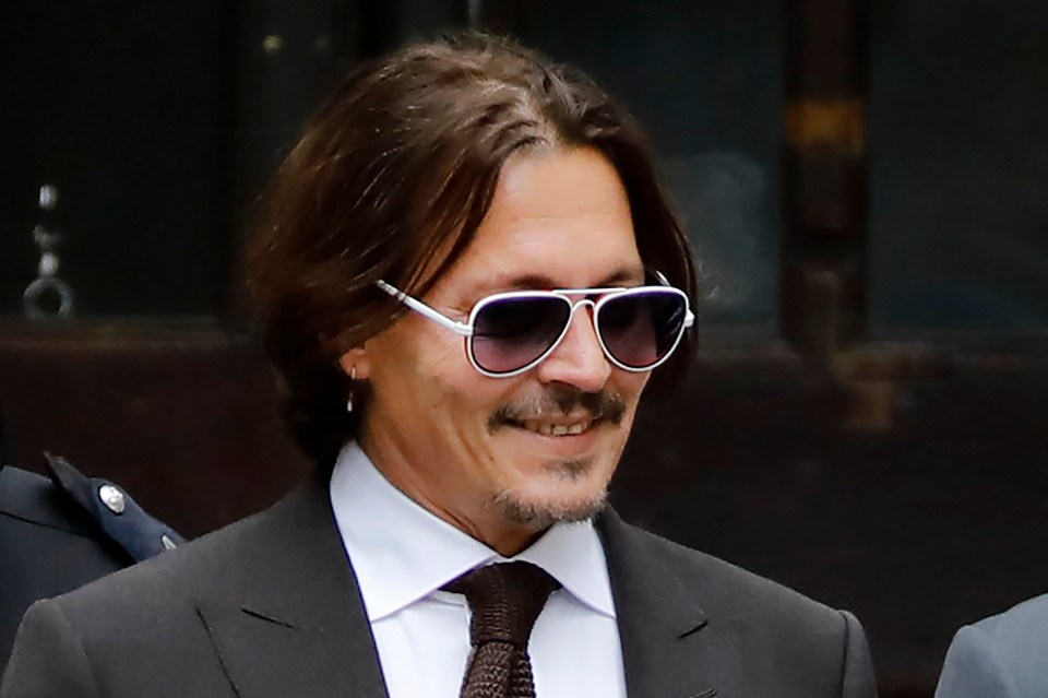 Depp was seen leaving court, smiling after the lengthy day of giving evidence 