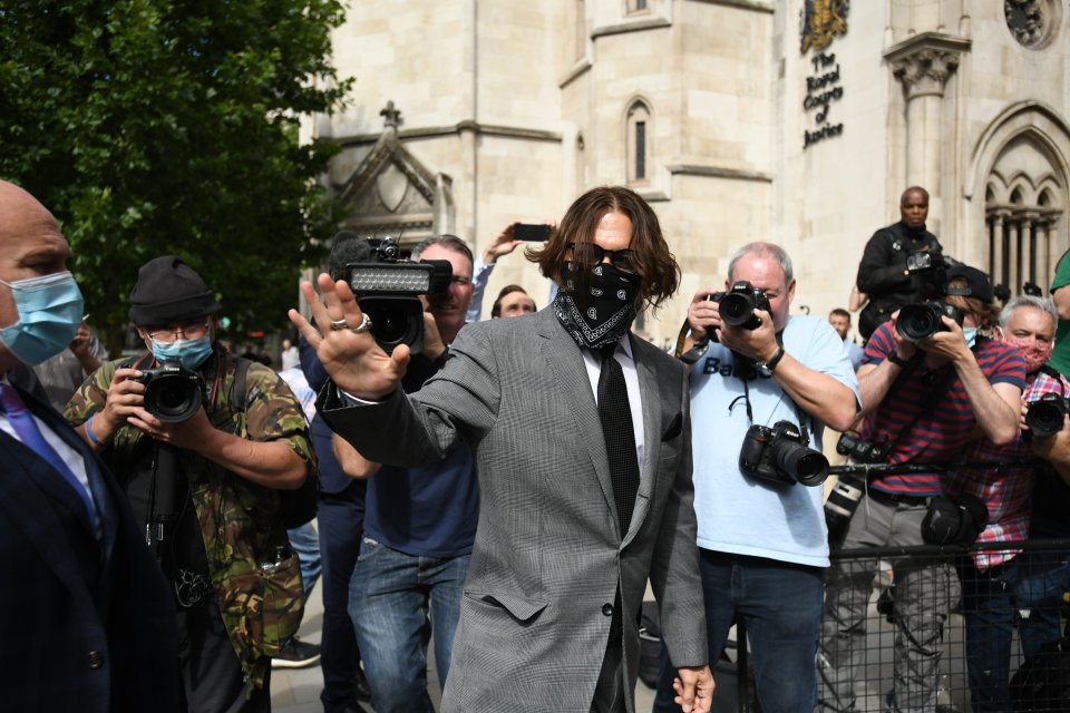 The actor is seen in a grey suit as he heads into the court