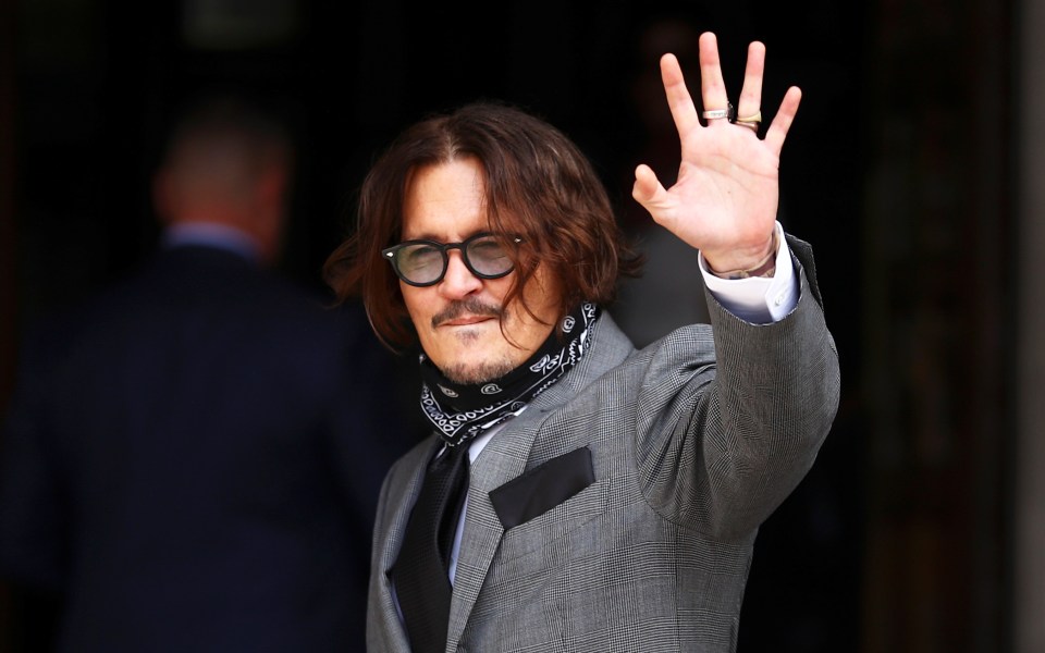 Depp had a black and white scarf around his neck 