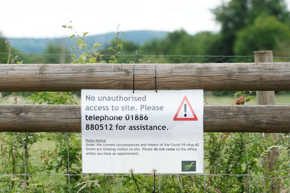 A sign outside the farm warns against entering