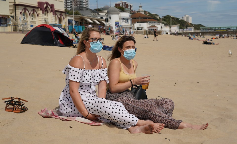 Jade (left) and best friend Ellena enjoy a drink on Bournemouth Beach