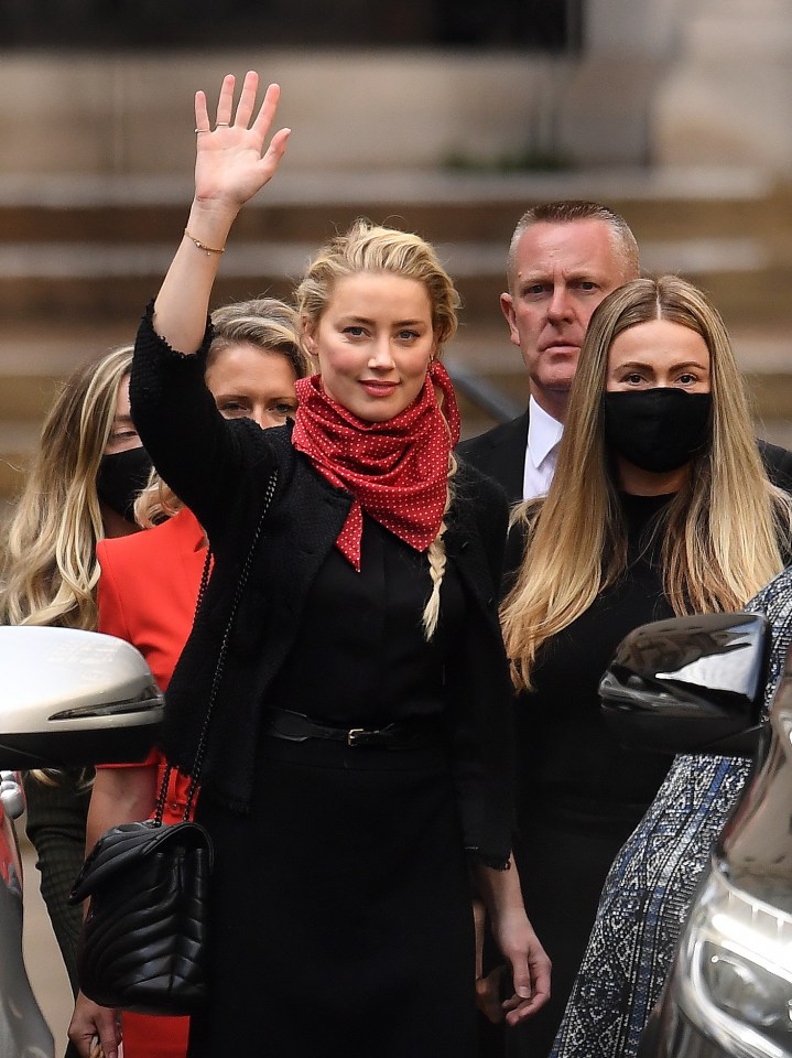 It was claimed Ms Heard, pictured waving leaving the high court, left her penthouse in 2016 with cuts and bruises