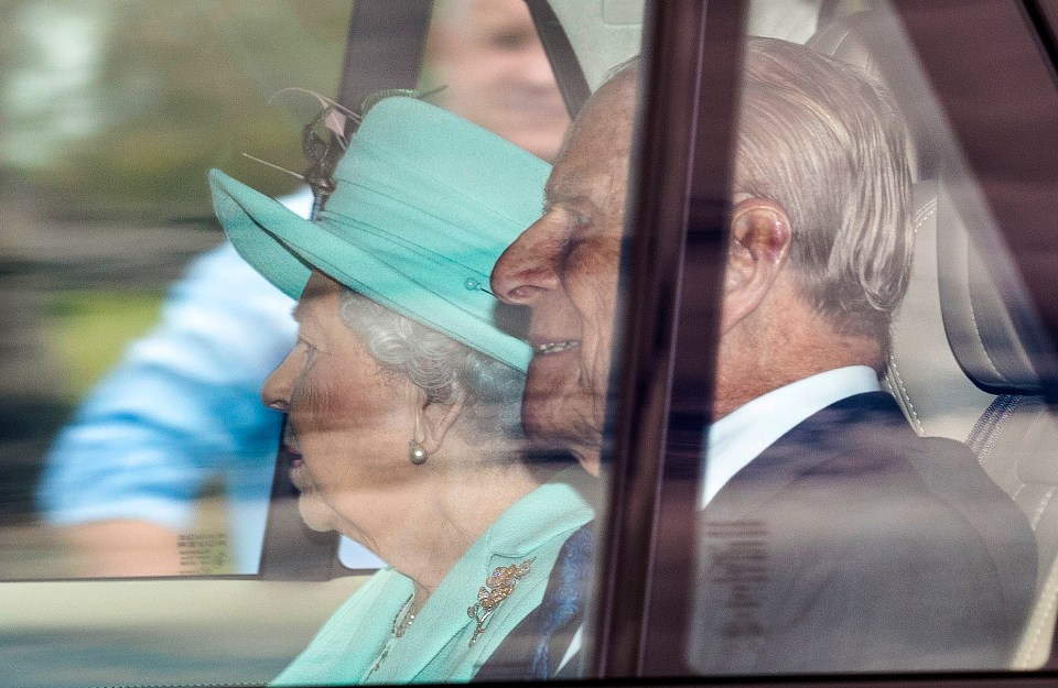 The Queen and Prince Philip were pictured being driven on the Long Walk in Windsor Great Park