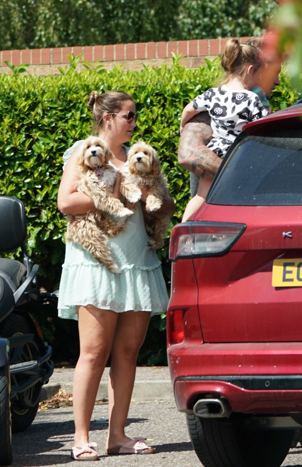 Doting dad Dan gets Mia, 2, out of the car