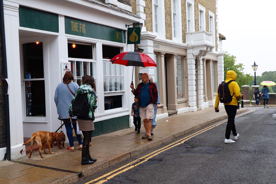 Rye, East Sussex, as visitors were forced to bring their brollies yesterday