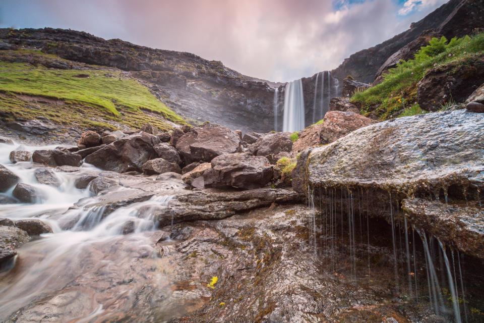 The 140 metres-high Fossá waterfall the Risin og Kellingin (the giant and the witch) rock formations are an incredible natural wonder