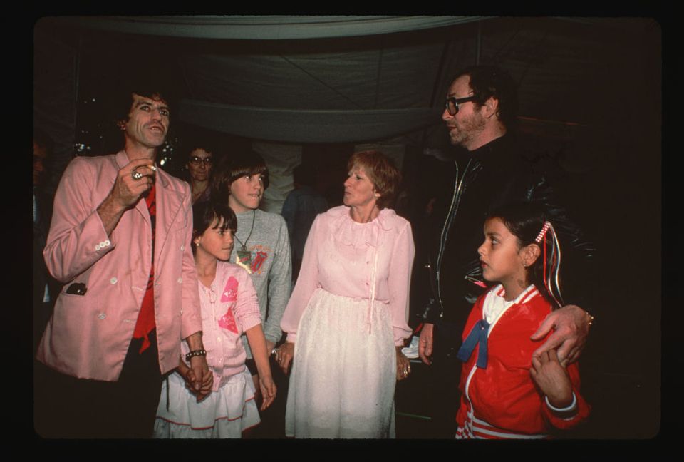 Keith Richards is seen on the left holding his daughter Angela's hand