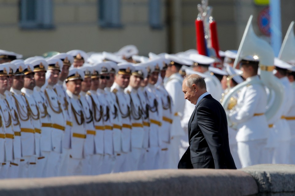 Vladimir Putin attends Navy Day celebrations in St Petersburg