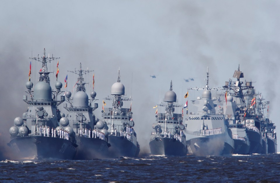 Russian warships sail during the Navy Day parade