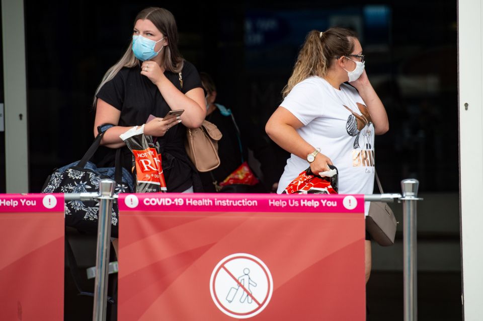 Passengers flying from Malaga arrive at Birmingham Airport