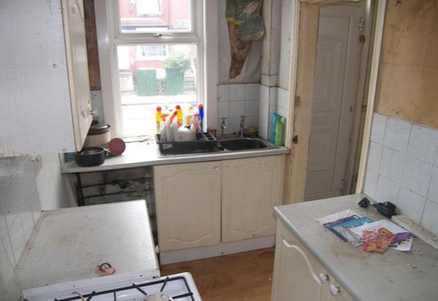 Leaflets lie on dust-covered worktops - but at least the washing up has been done 