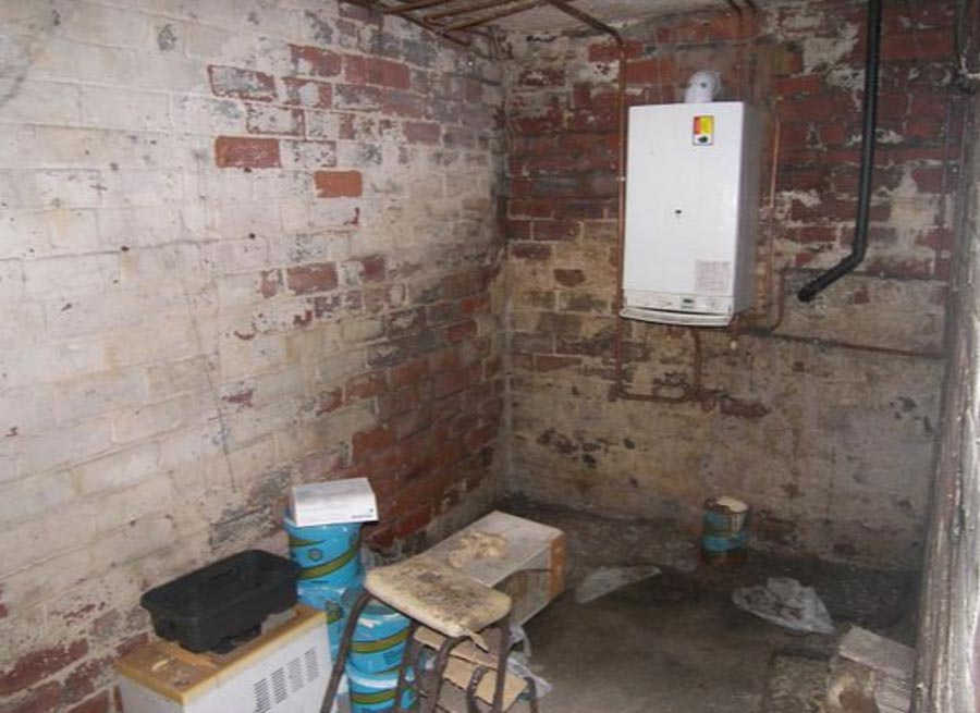 Downstairs, there's also a boiler room, which has been used as another dumping ground by the owner