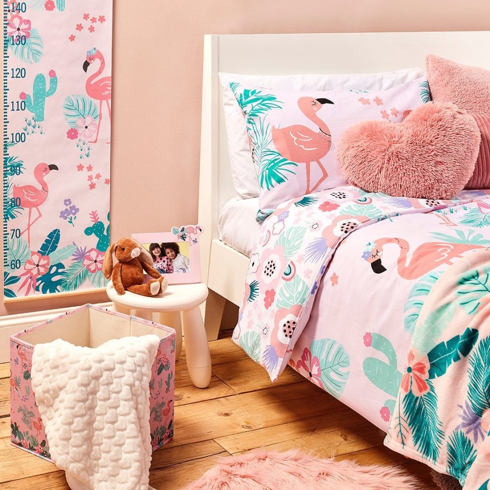  You'll even find storage boxes, photo frames and a height chart in bright flamingo print