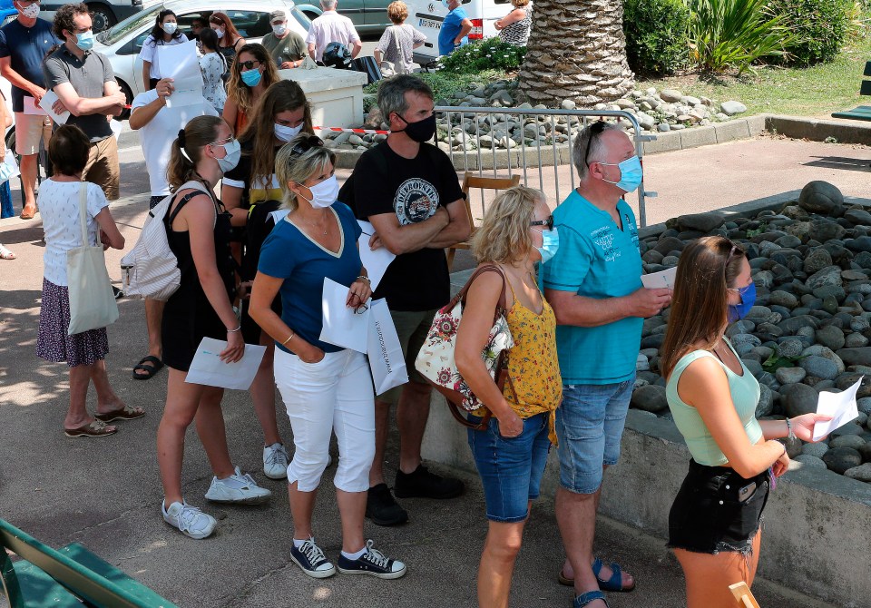 People queue up to get tested by health workers in Saint Jean de Luz