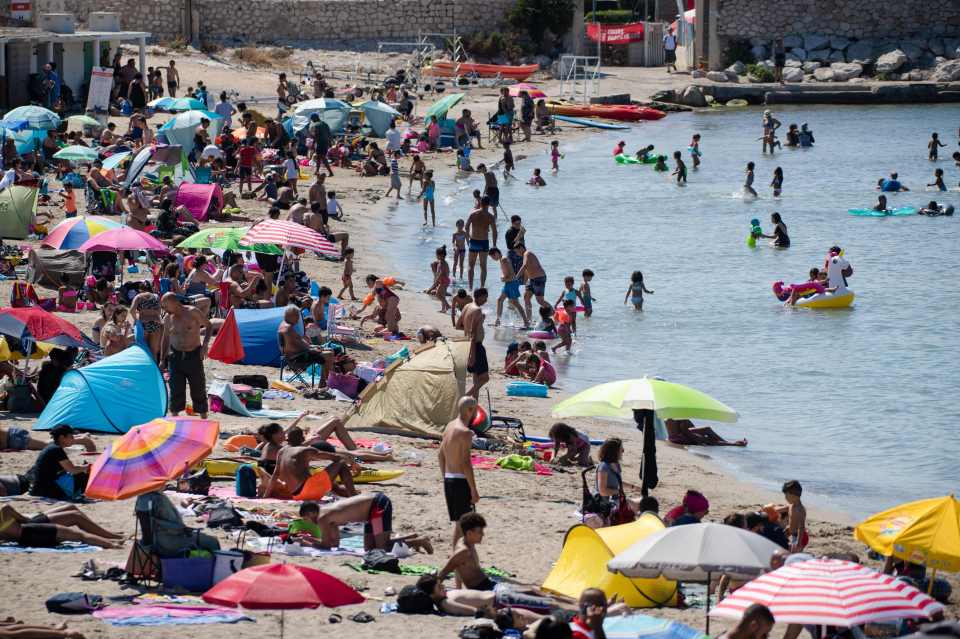 French beachgoers soak up some sun in Marseille