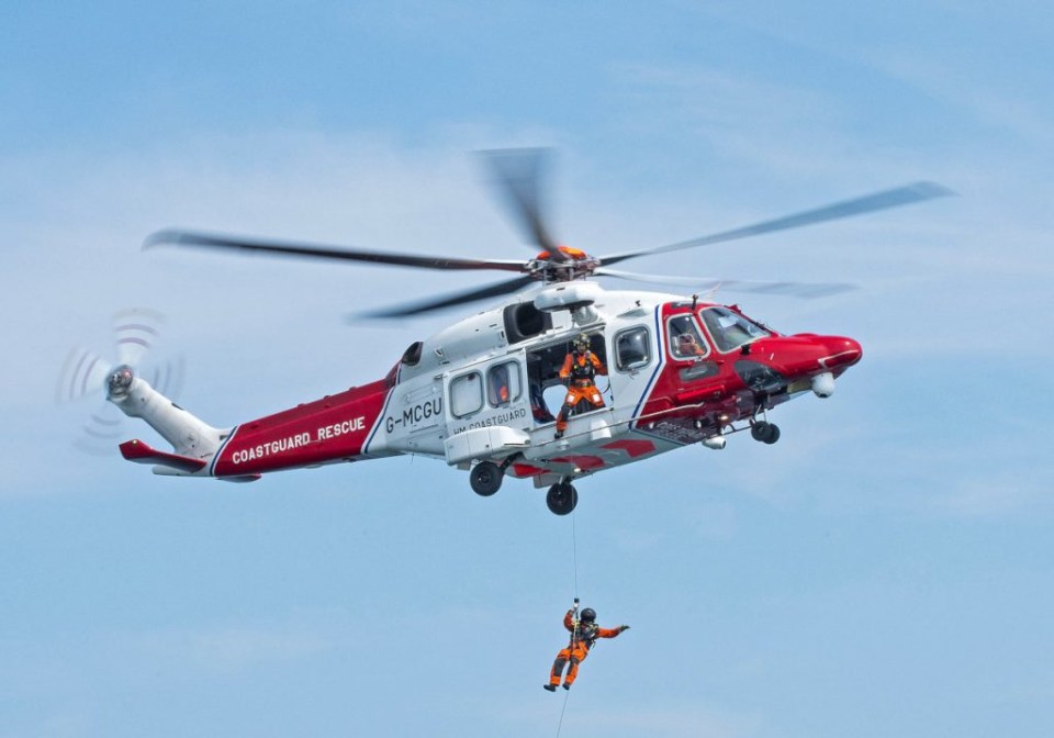 Coastguard officials rushed to Dymchurch, Kent, in a helicopter after two children were swept away this afternoon