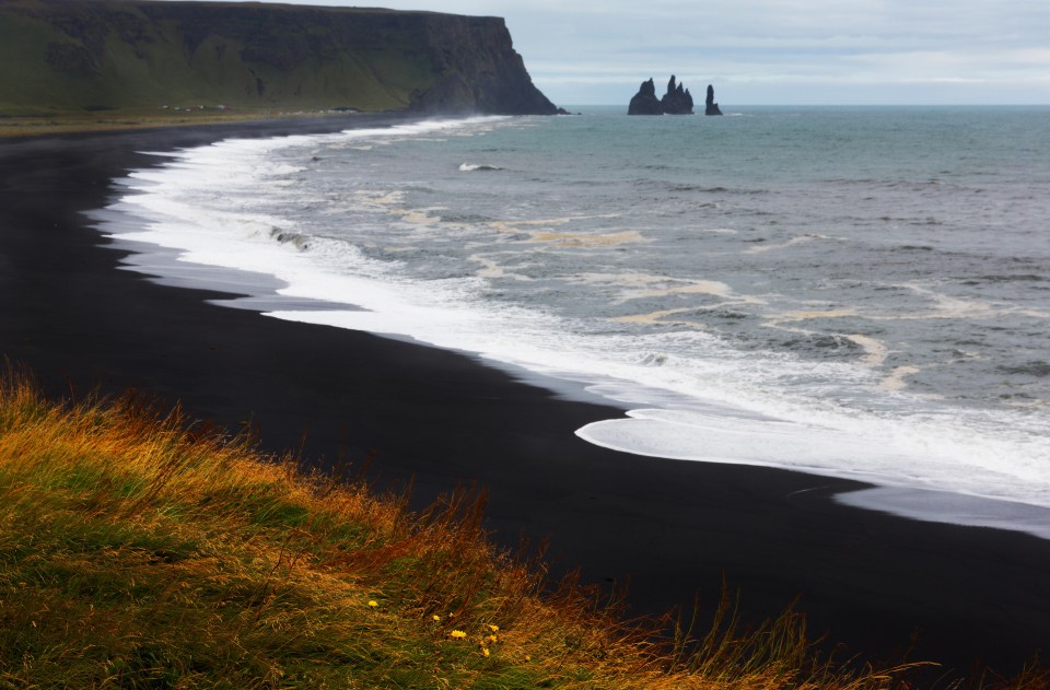 Black sandy beaches are common across Iceland