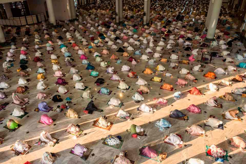 Muslims attend Eid al-Adha socially distanced prayers at a mosque in Surabaya, Indonesia 