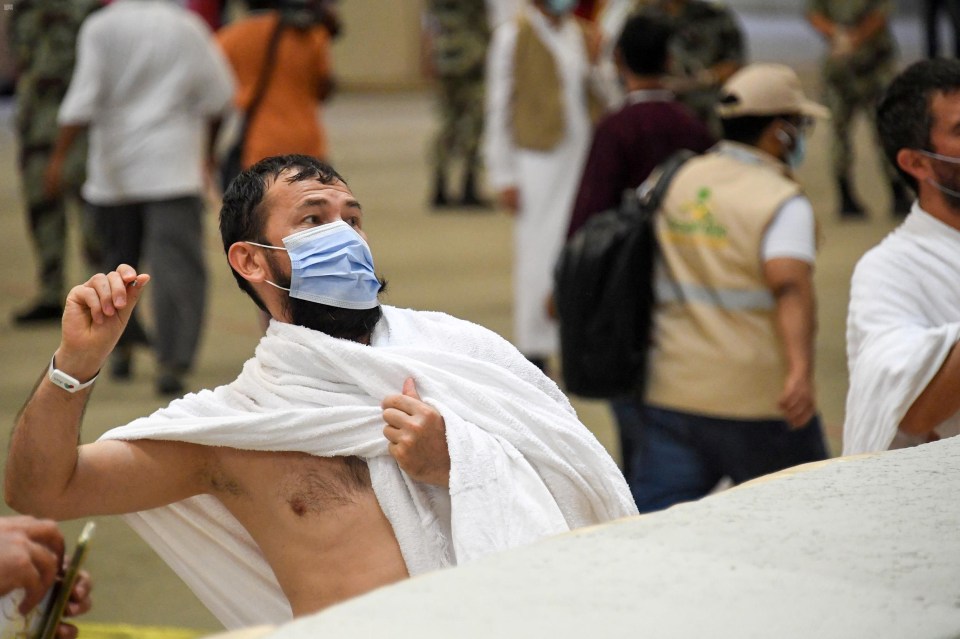 Muslim pilgrims cast stones at pillars symbolising Satan during the annual Haj pilgrimage