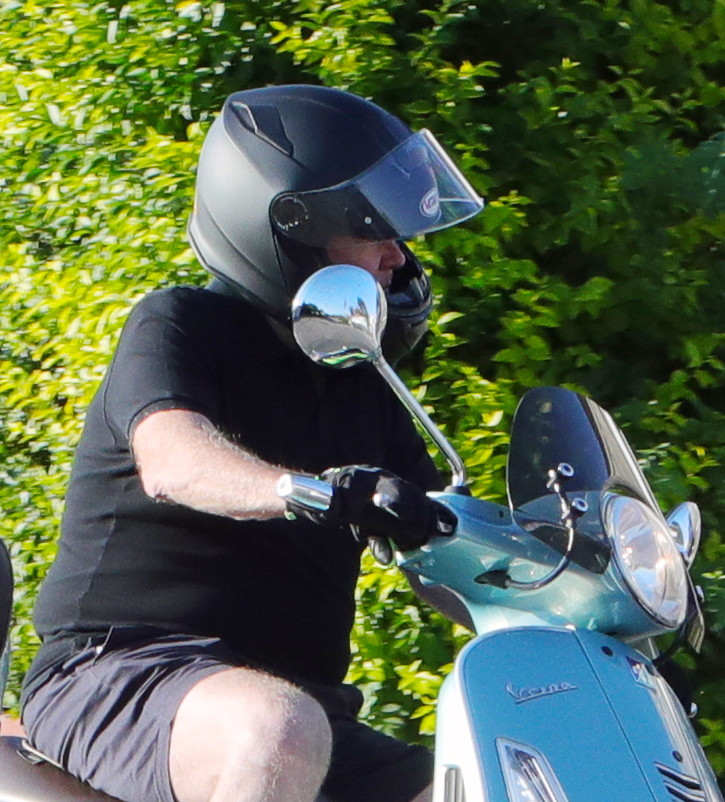 Steve McFadden arrives at work on his moped after a four month break over lockdown