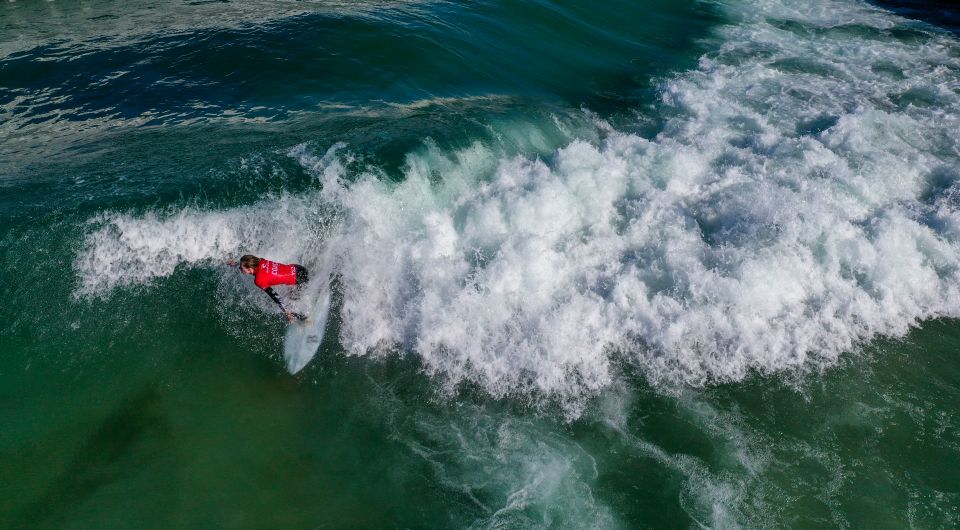 A surfer makes the most of the hot weather