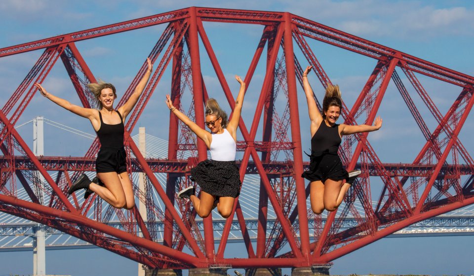 Three pals soak up the sunshine in South Queensferry, close to Edinburgh, which saw highs in the mid 20s today