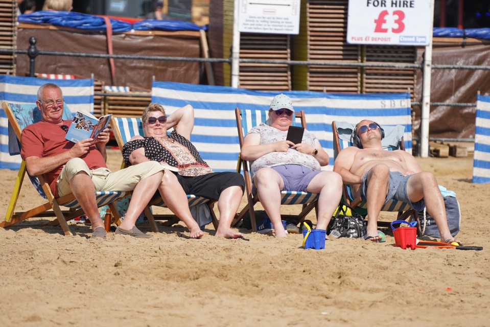 A group in deckchairs soak up the rays