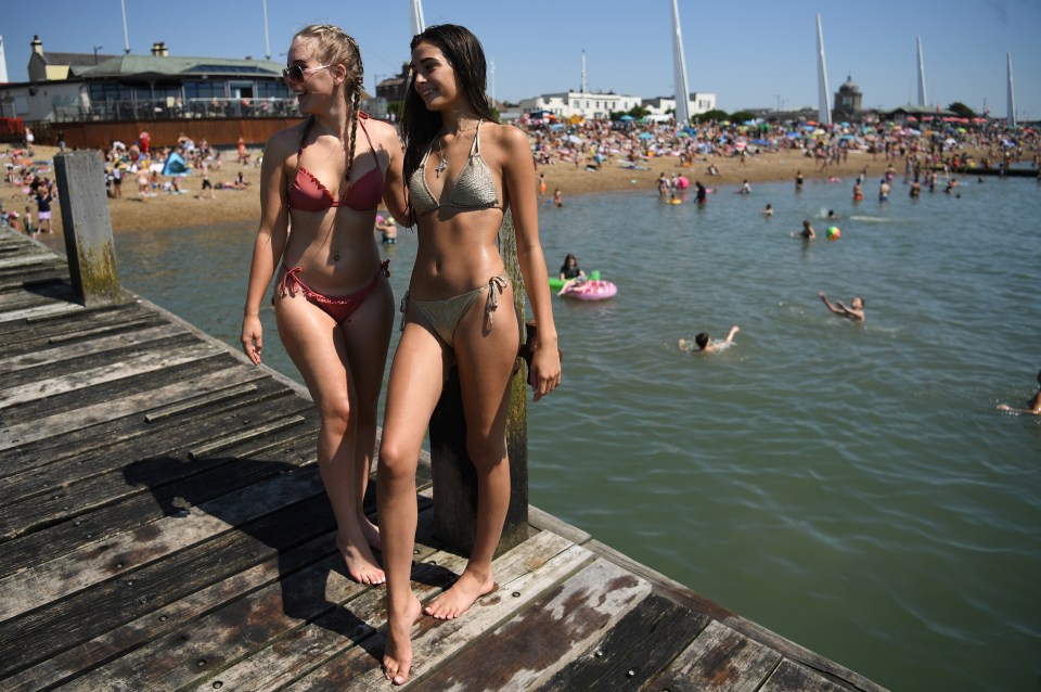 Two sunbathers pose at Southend beach