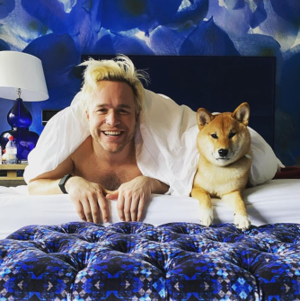  Olly can be seen chilling at home with his girlfriend and dog on Instagram