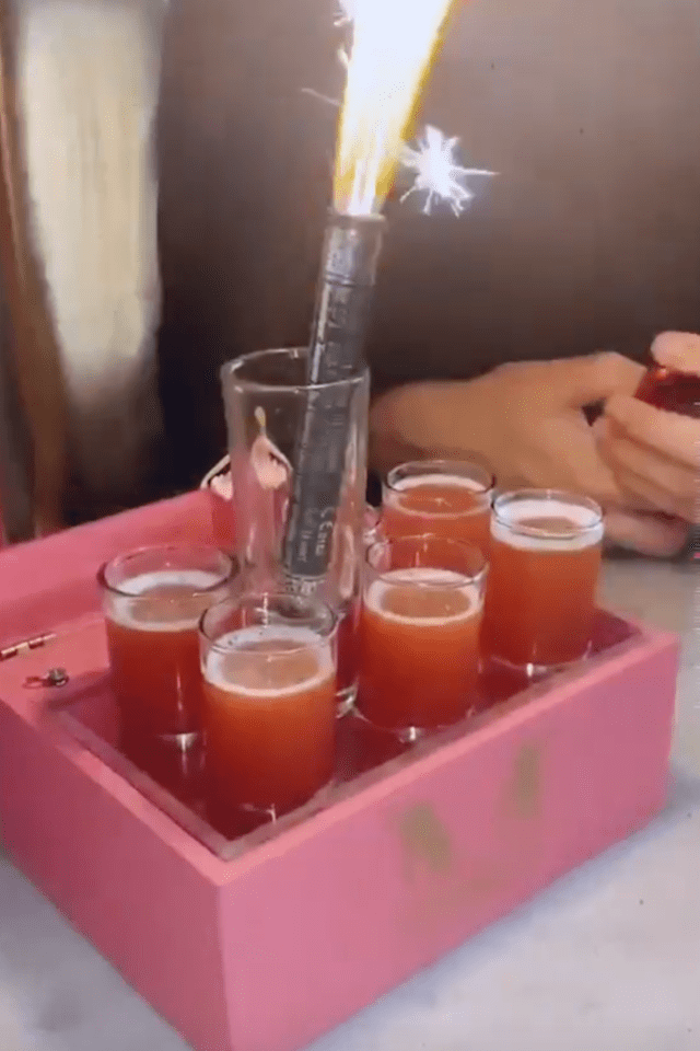 The Love Islanders got stuck into a tray of orange shots decorated with a sparkler