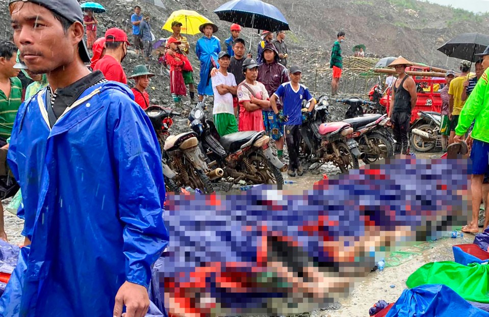 Bodies lie in rows after being recovered from the landslide 