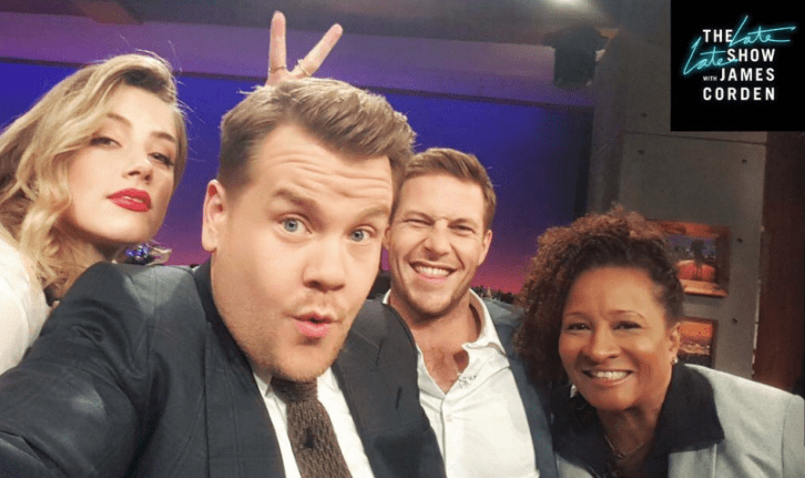 Heard poses with fellow guests Luke Bracey and Wanda Skyes on the Late Late Show with James Corden