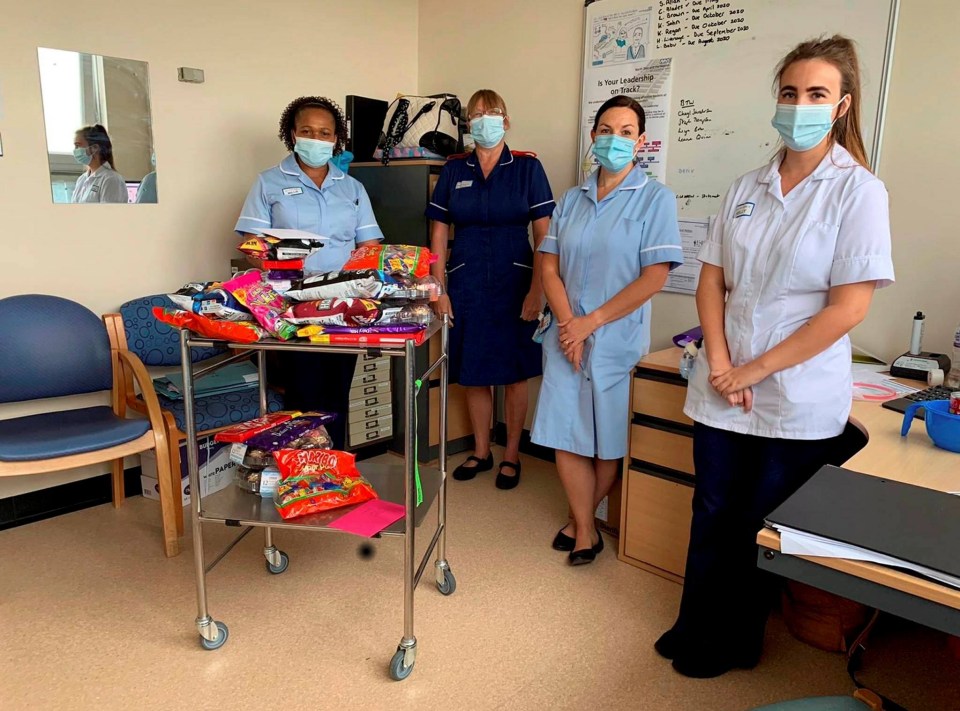 Millie (far left) said her colleagues' warm welcome 'made her day'