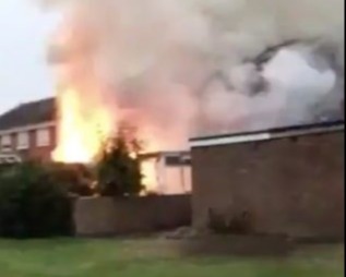 A house burst into flames after being stuck by a lightning bolt yesterday