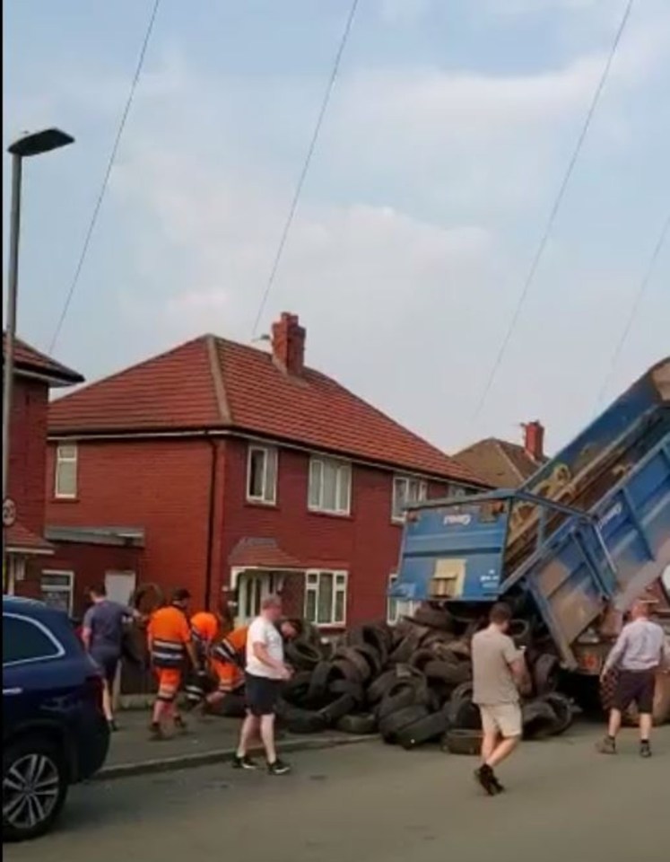 A second video then shows the truck reversing towards the front garden of a house, before the tyres are tipped out