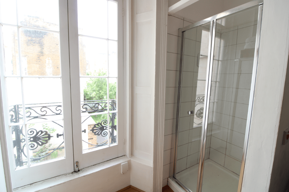 The studio is small - but it comes with a shower, French windows and a washing machine. Image: Zoopla