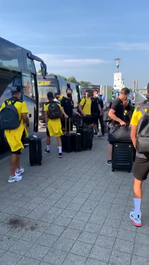 Fans took snaps of the squad as they left the bus and headed for check-in