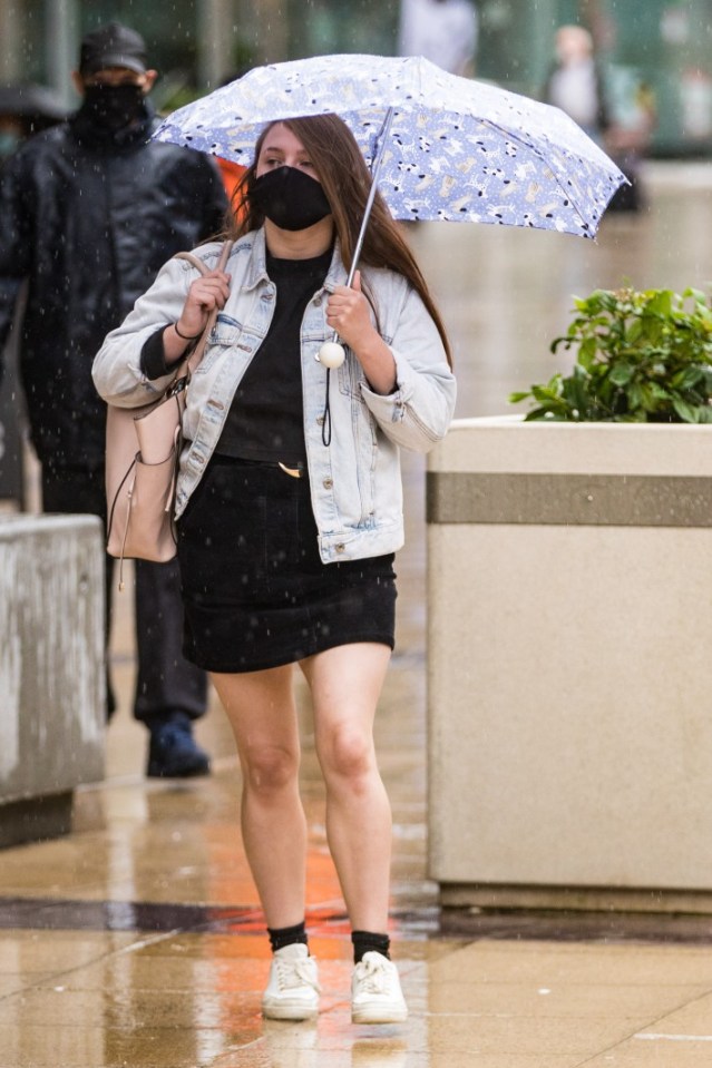 The North of England has already seen heavy rain, as this woman in Manchester can attest