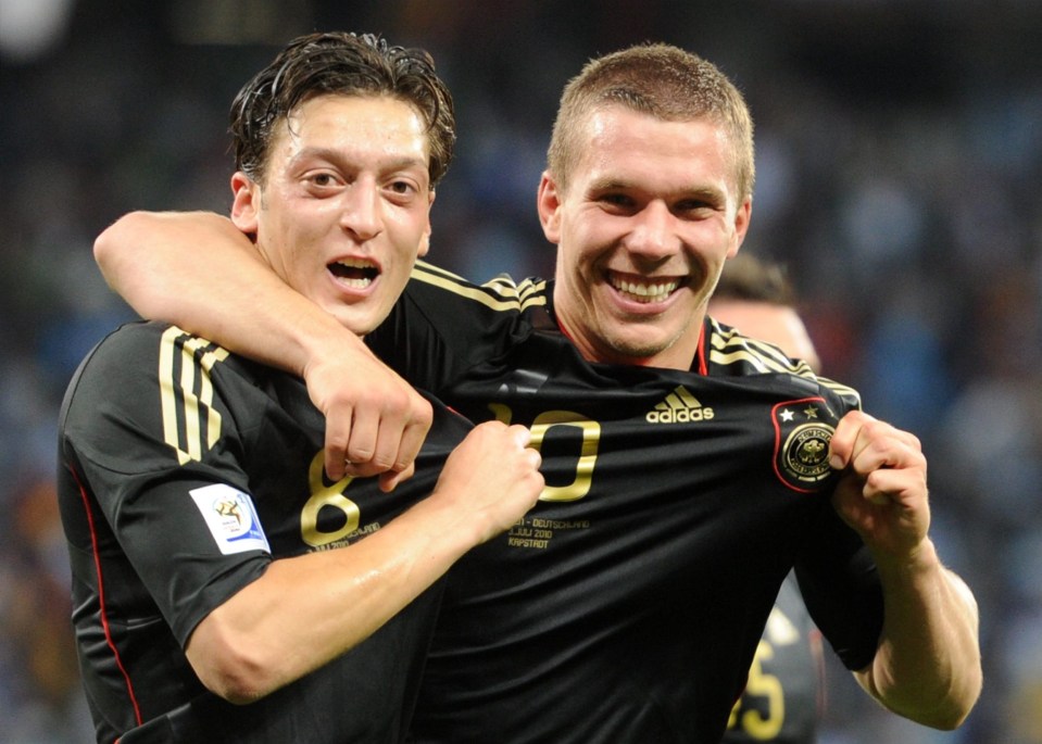 Lukas Podolski (right) insists Ozil is a good character and good enough to be Arsenal's main man