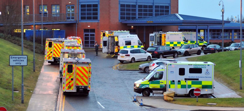 Queues of ambulances outside an NHS hospital