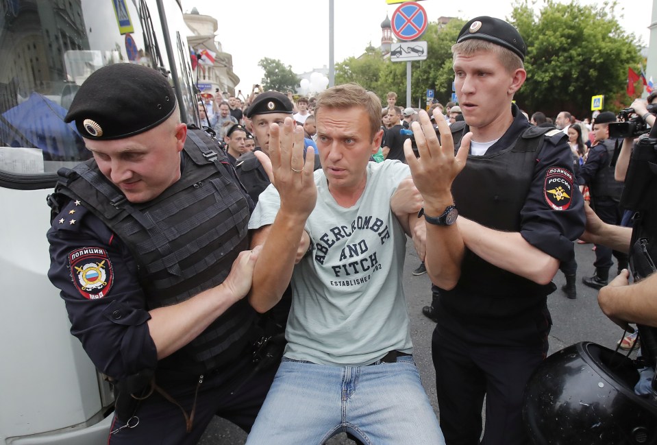 Russian cops arrest Navalny during a protest in June 2019