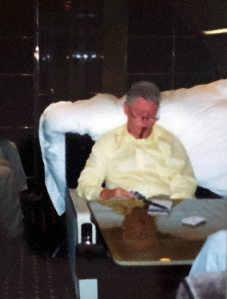 Bill Clinton plays cards and chomps on a cigar aboard the Lolita Express