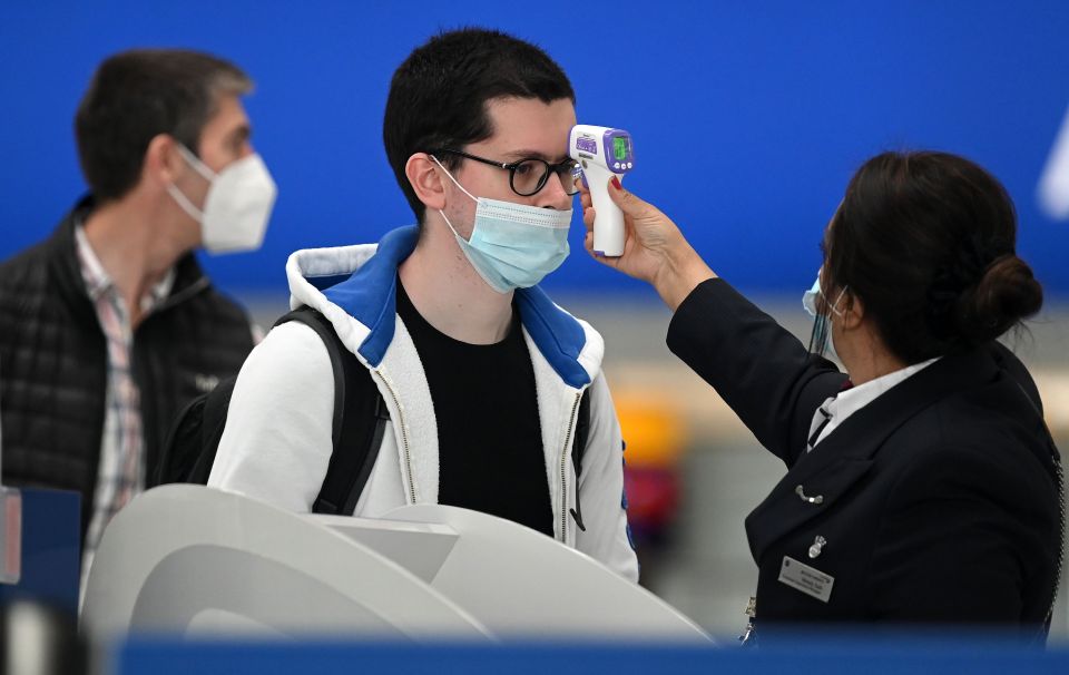 Temperature checks carried out at airports in a bid to slow the spread of the virus