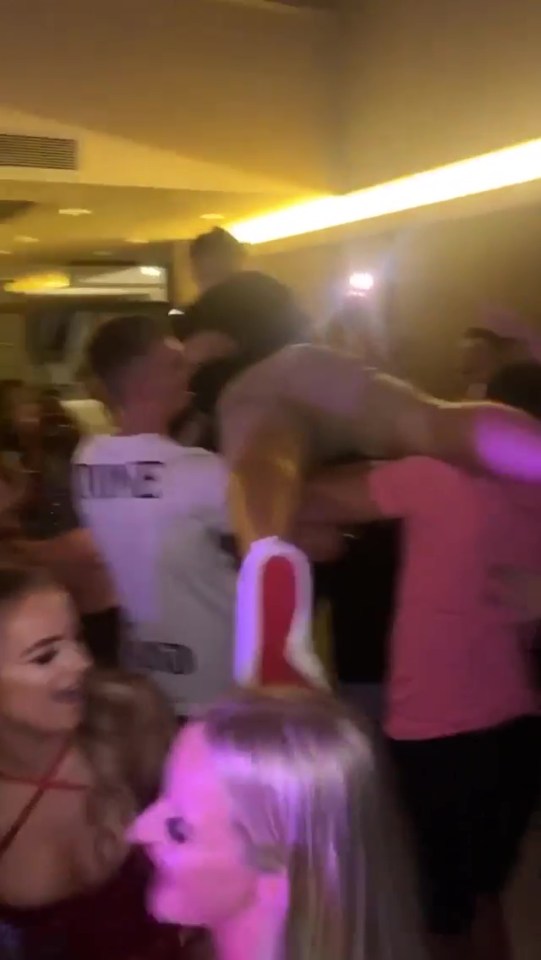 Camera phone footage showed a crammed dance floor and Arron being carried by his mates