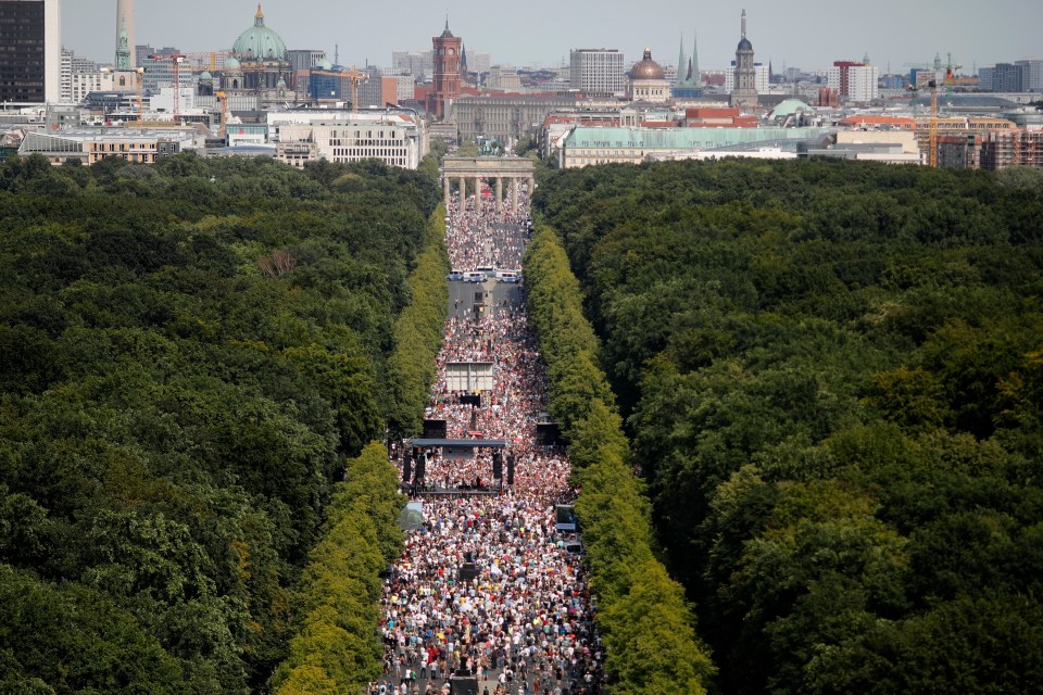 A huge crowd marched from the Brandenburg Gate in central Berlin through a wide boulevard heading towards the Tiergarten