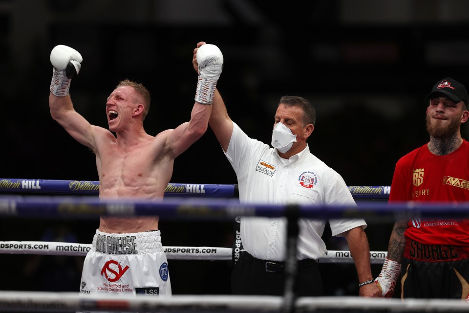 Ted Cheeseman celebrates after winning a brutal war against Sam Eggington