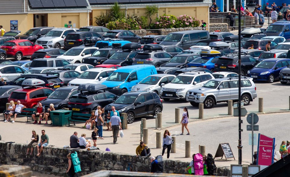 A full beach carpark in the town of Perranporth 