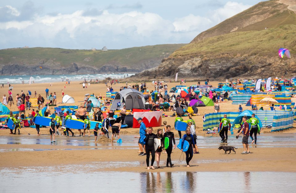 Tourists flock to the Perranporth beach in Cornwall